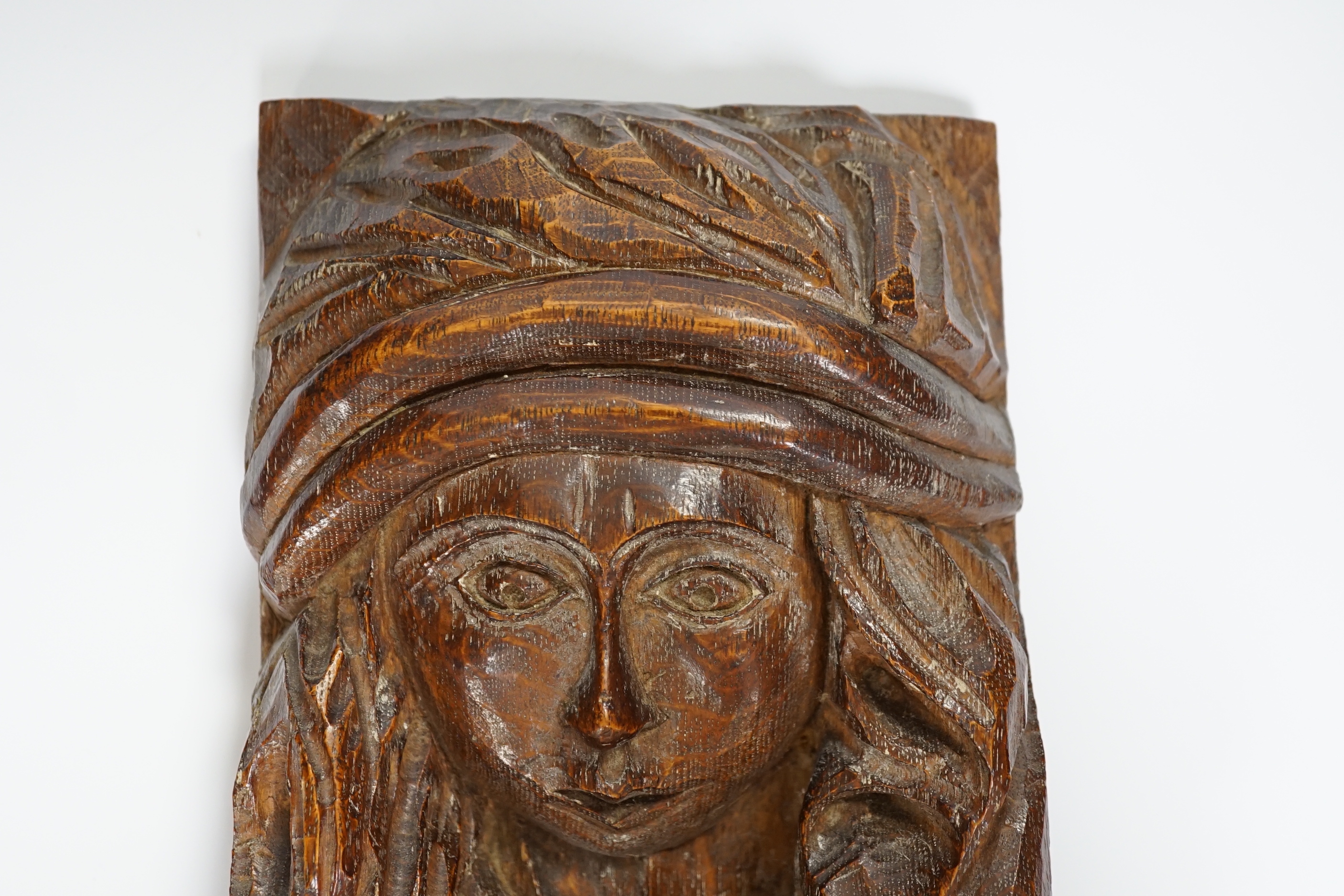 A small carved oak figure of a maiden, 28cms high